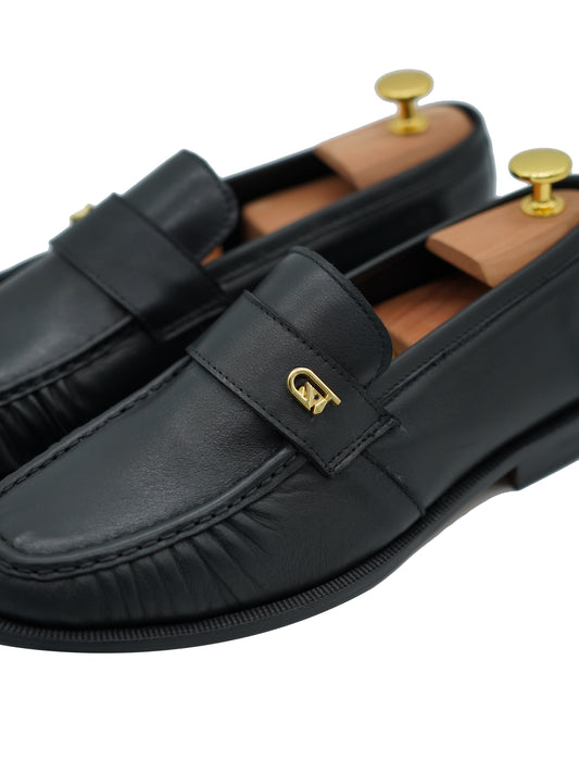 Mocassino tubolare in pelle sauvage nera con arriccio e fibbia GT in metallo oro