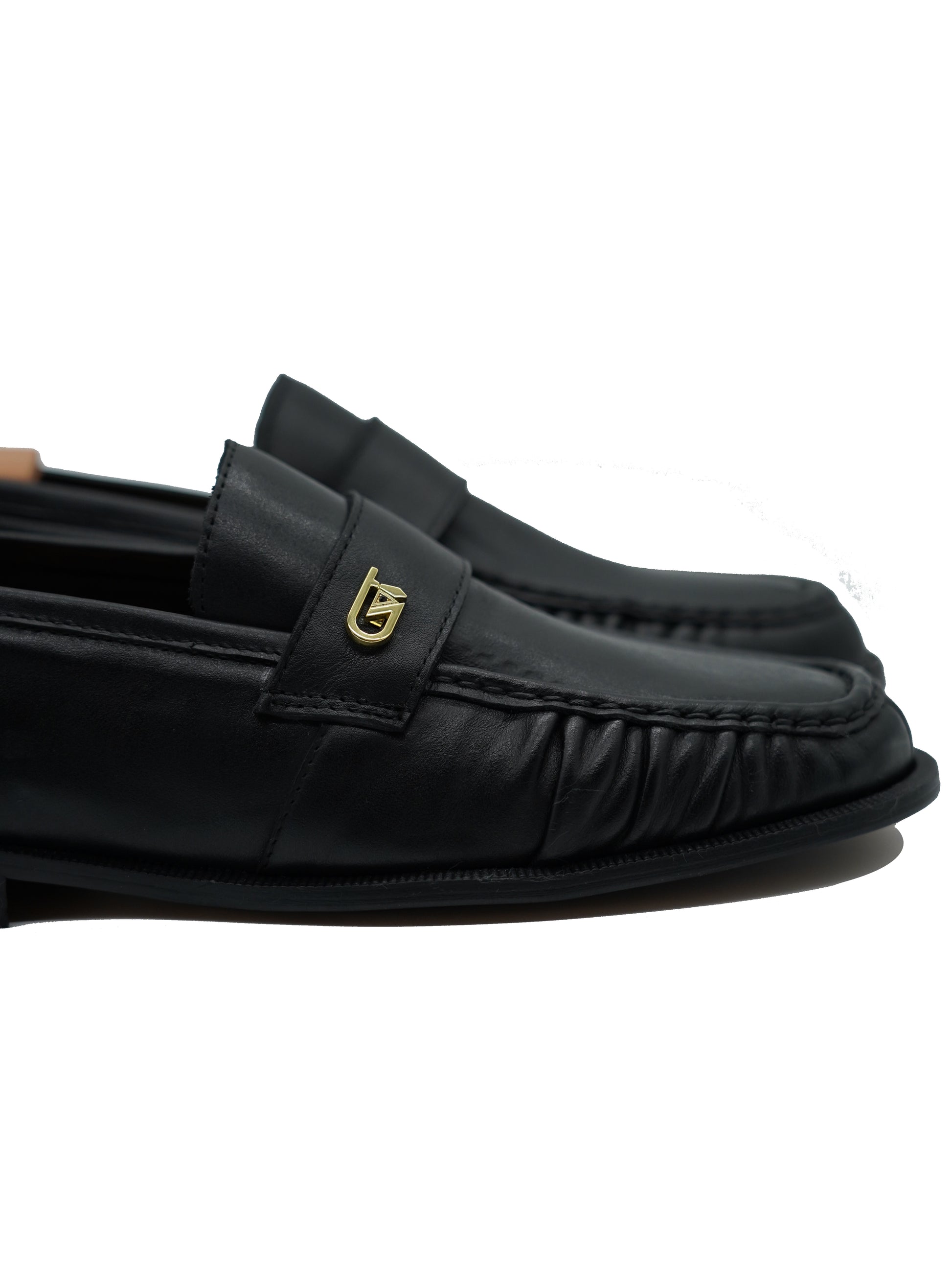 Mocassino tubolare in pelle sauvage nera con arriccio e fibbia GT in metallo oro