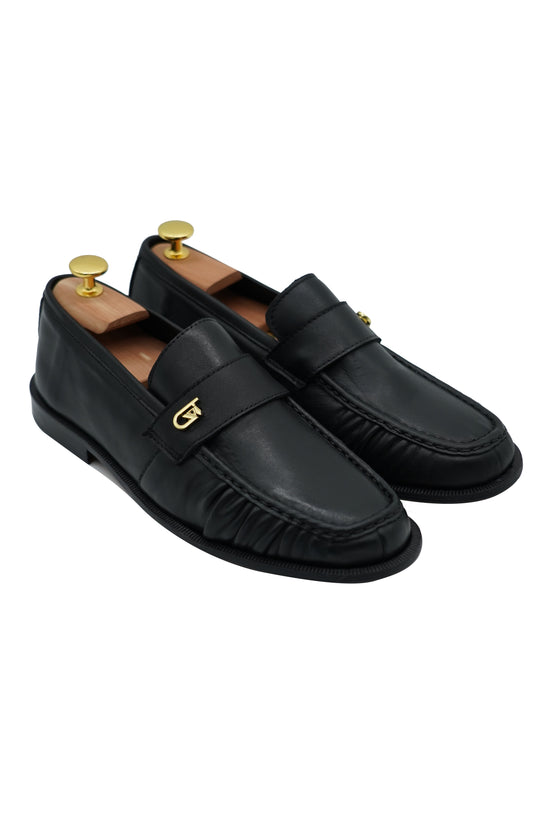 Mocassino tubolare in pelle sauvage nera con arriccio e fibbia GT in metallo oro