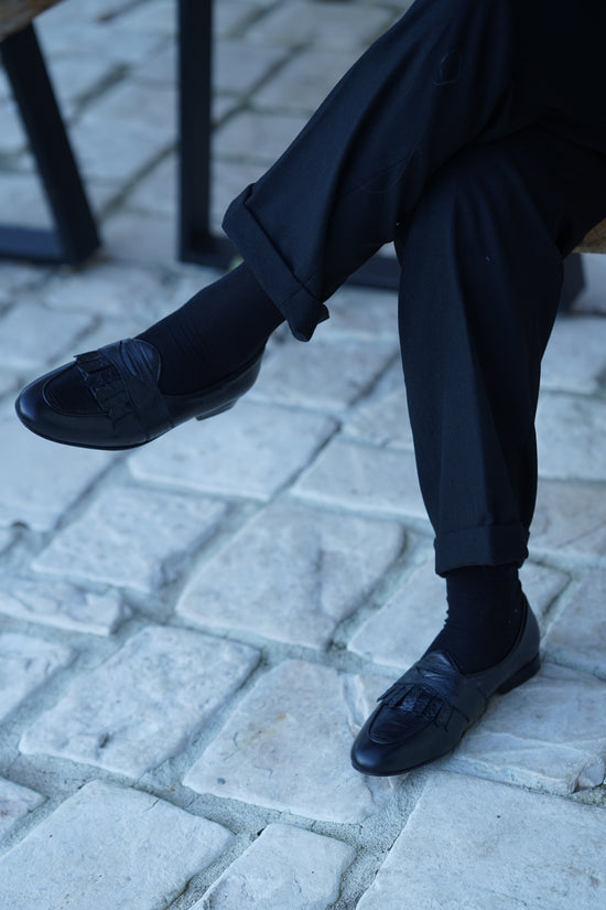 Mocassini con benda e frange cocco nero