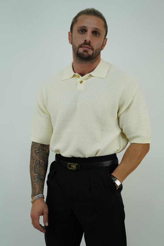 Polo in cotone smacchinato panna con bottoni oro