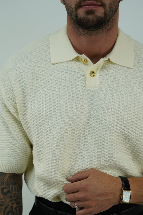 Polo in cotone smacchinato panna con bottoni oro