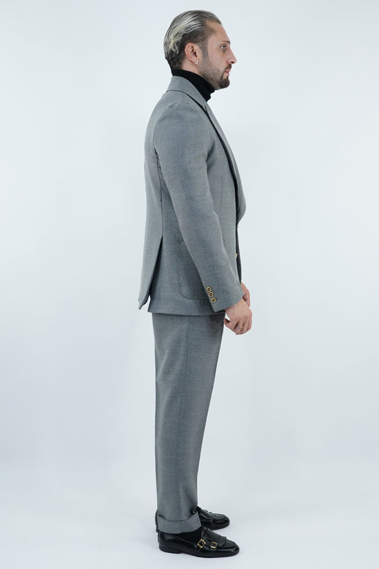 Abito extensive monopetto petto a lancia diagonale cenere con bottoni oro