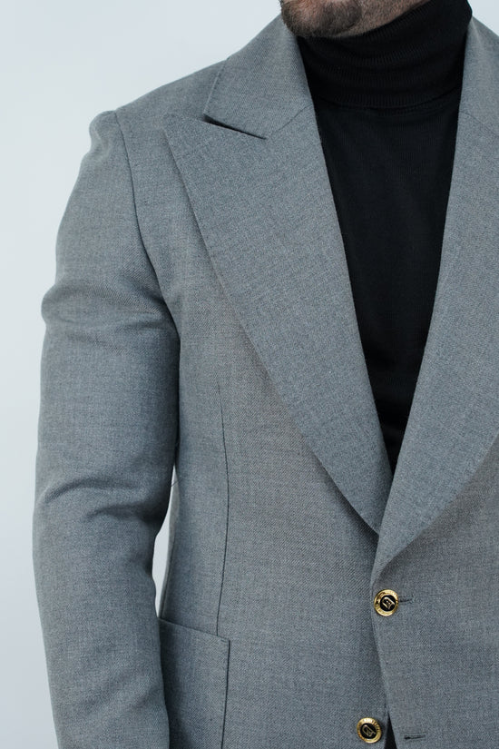 Abito extensive monopetto petto a lancia diagonale cenere con bottoni oro