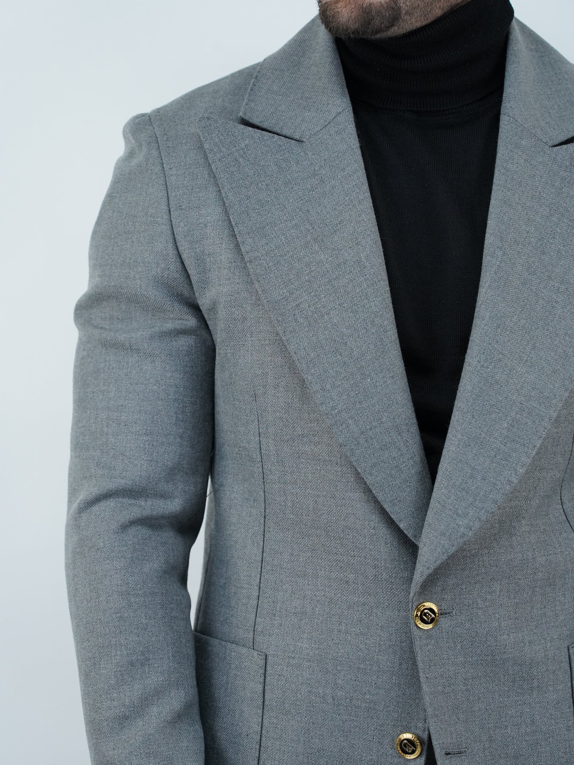 Abito extensive monopetto petto a lancia diagonale cenere con bottoni oro