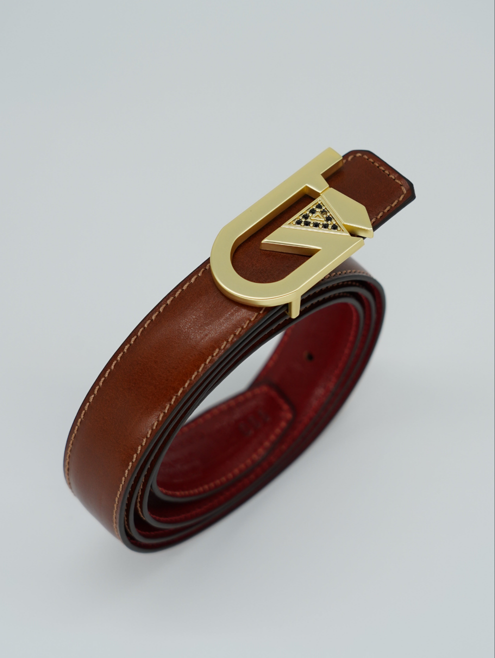 Cintura GT reversibile 2,5cm in pelle di vitello primo fiore tamponato a mano rosso Inglese/cuoio con fibbia oro satinato